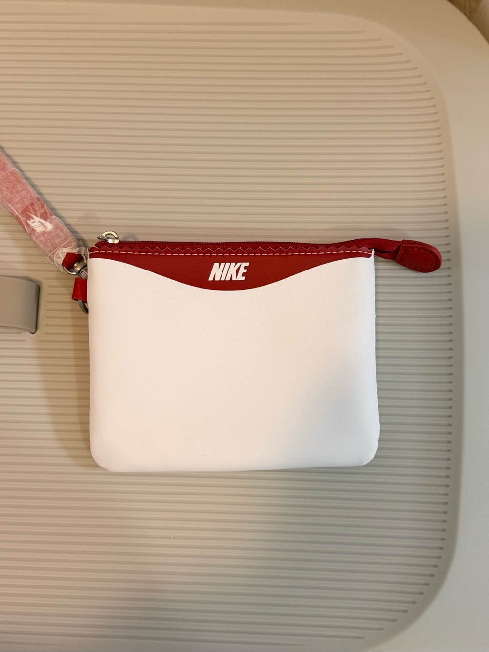 Nike White Wristlet Pouch with Red Swoosh and Blue Accent - Picture 2 of 3